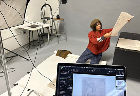 SAAH UIC Photography Lab Student on backdrop
